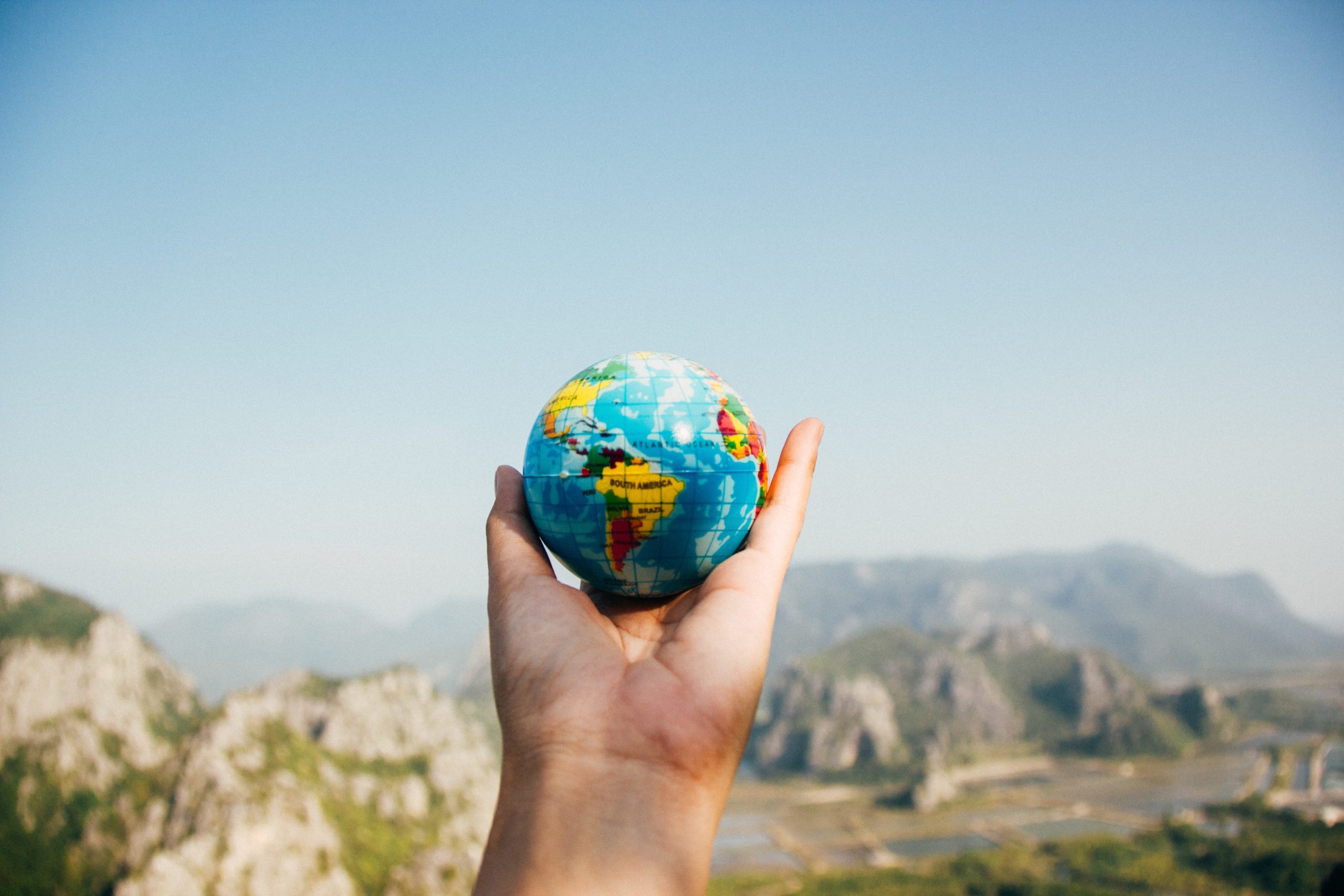 Stock picture of globe being held in a hand